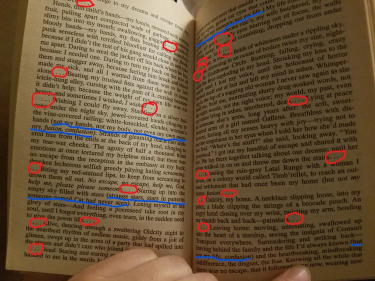 A page from Psion marked with red circles around ellipses and blue underlines beneath parenthetical asides